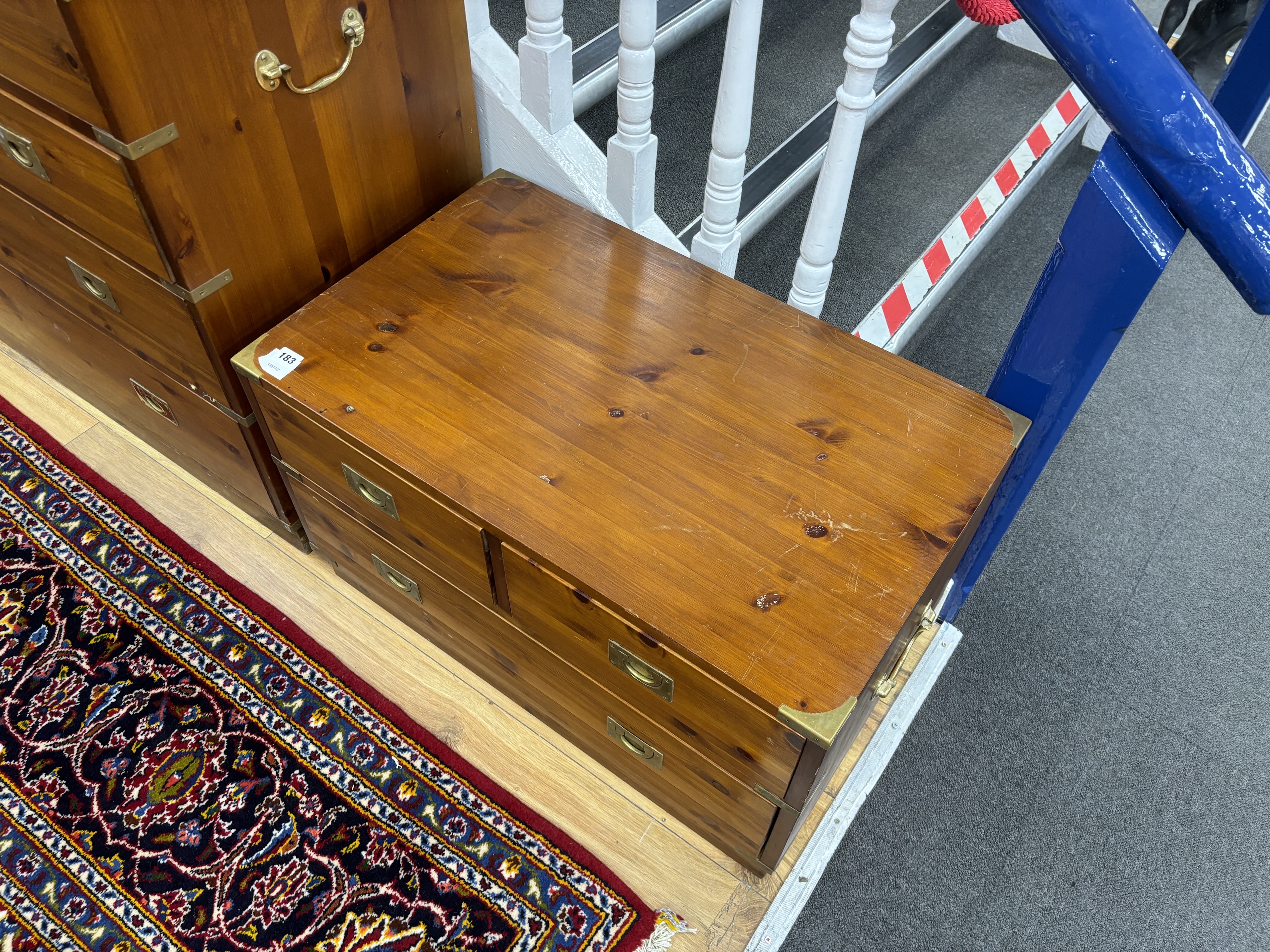 A pair of military style brass mounted pine three drawer low chests, width 77cm, depth 46cm, height 46cm